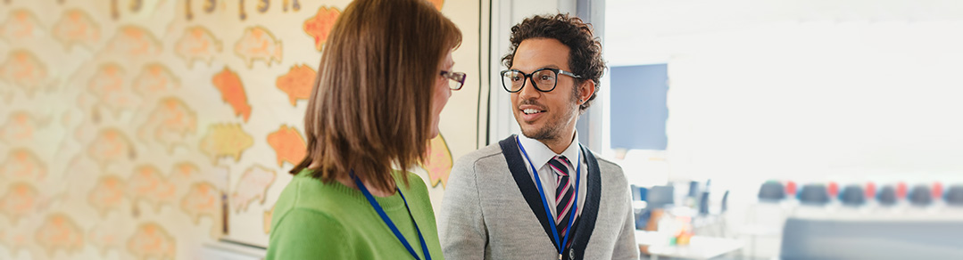 educators talking in a classroom setting
