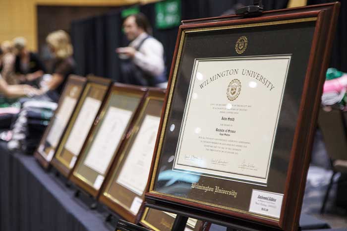 Looking down a row of diplomas on a table.