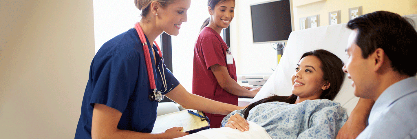 Nurses smiling at a smiling patient